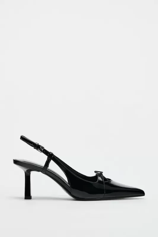 Medium slim heeled mule shoes with a bow