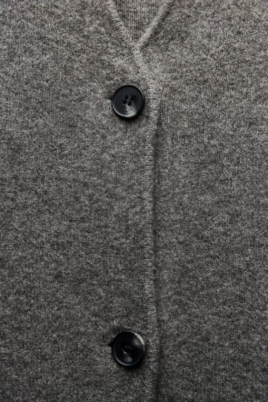 Knitted coat with patch pockets