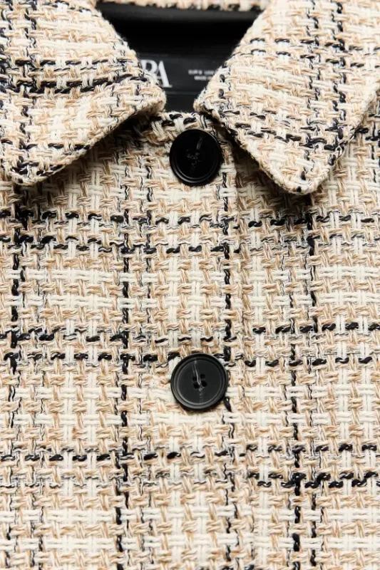 Short jacket made of embossed fabric